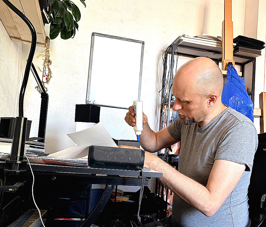 m v baks at work on cubes at his studio